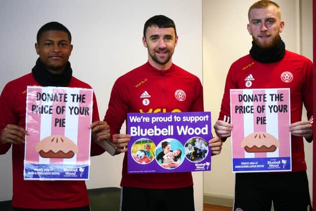 Sheffield United's Oli McBurnie helps raise money for charity with team mates Rhian Brewster and Enda Stevens