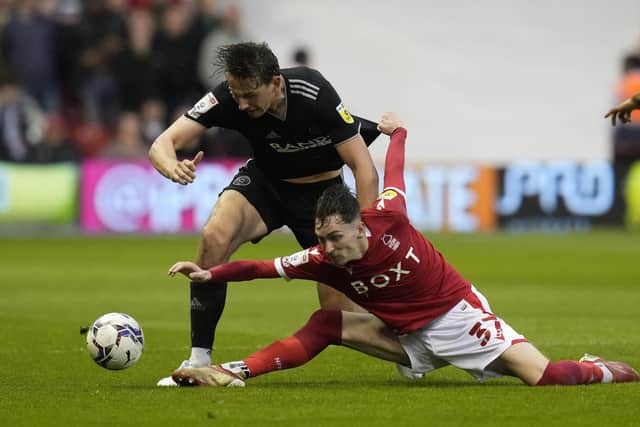 Sheffield United's all-black away kit also caused problems against the red of Nottingham Forest for some colourblind fans: Andrew Yates / Sportimage