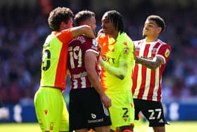 Sheffield United's Jack Robinson and Nottingham Forest's Djed Spence clash during the Sky Bet Championship play-off semi-final, first leg match at Bramall Lane, Sheffield. Picture date: Saturday May 14, 2022. PA Photo. See PA story SOCCER Sheff Utd. Photo credit should read: Martin Rickett/PA Wire.