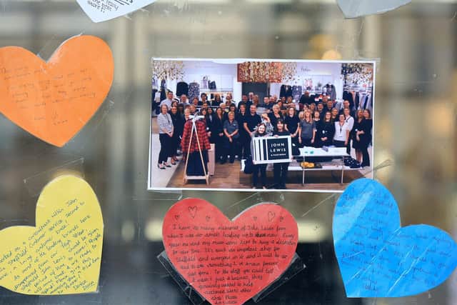 Messages from staff and customers written on hearts and pictures were placed on the front doors of John Lewis in Sheffield after the store closed
