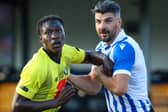 Callum Paterson wrestles with a defender during Sheffield Wednesday's win over Harrogate Town. Credit: Harrogate Town FC