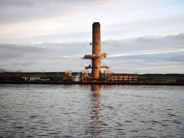 The first explosives detonate and the demolition process is underway