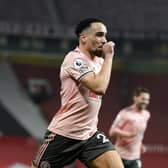 Kean Bryan celebrates his goal for Sheffield United at Old Trafford: Andrew Yates/Sportimage