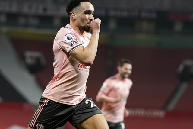 Kean Bryan celebrates his goal for Sheffield United at Old Trafford: Andrew Yates/Sportimage