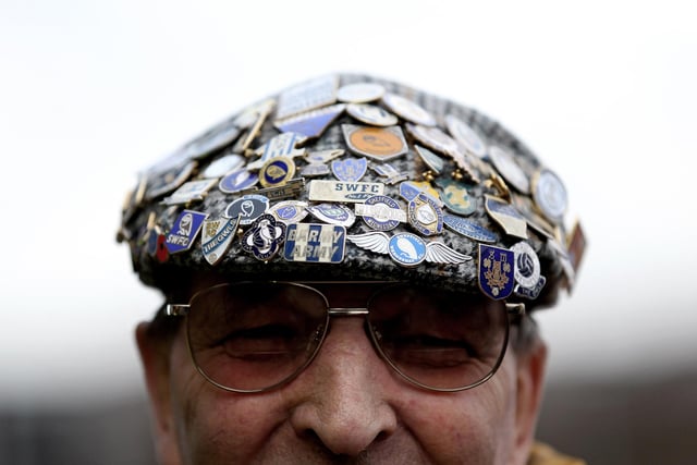 A fan wears a hat covered in Wednesday badges prior to the third round tie with West Ham United at Hillsborough in January 2012.
