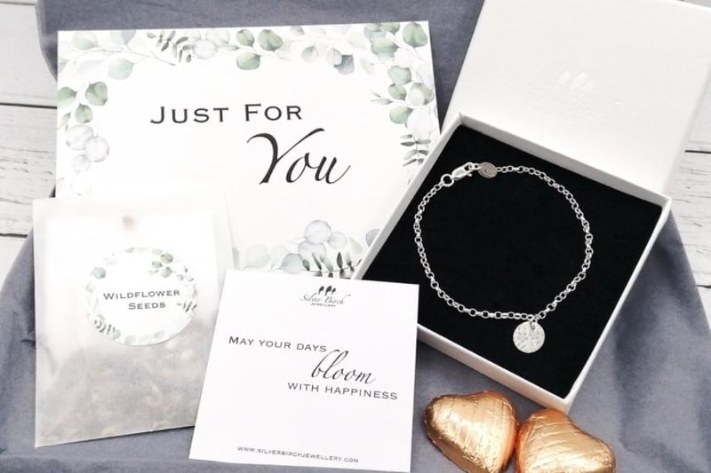 Amy Stevenson has put together a bespoke gift box, including a silver bracelet with a floral embossed charm (7.5" adjustable to fit). It also includes a wildflower seed pack, choice of inspirational quote gift card, 2 Belgian milk chocoalte hearts and a personalised card. Find her on silverbirchjewellery.net