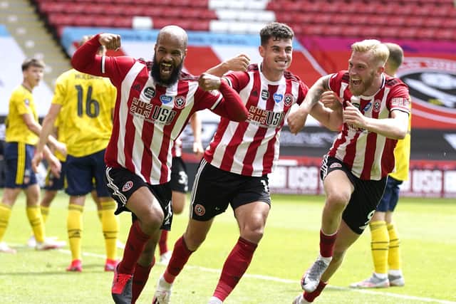 David McGoldrick of Sheffield Utd (L) celebrates after scoring with team mates John Egan of Sheffield Utd and Oli McBurnie of Sheffield Utd during the FA Cup match at Bramall Lane, Sheffield. Picture date: 28th June 2020. Picture credit should read: Andrew Yates/Sportimage