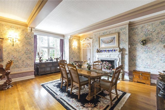 The large dining room features a beautifully ornate fireplace at its heart, and offers plenty of space to accommodate both family and guests.
