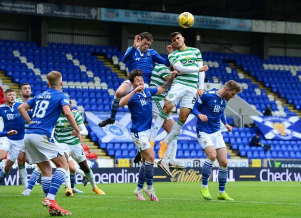 Mohamed Elyounoussi of Celtic and Murray Davidson of St Johnstone battle for the ball. (Photo by Mark Runnacles/Getty Images)