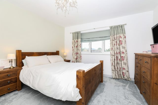 The main bedroom has a newly-fitted carpet and a rear-facing double glazed window offering further good views.