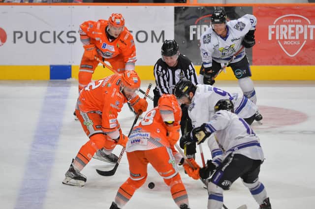 Sheffield Steelers Justin Hodgman jousts for possession against Manchester Storm