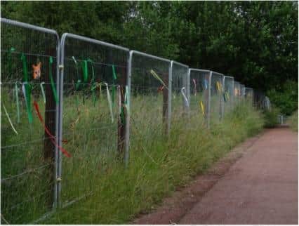 Residents have tied ribbons and messages on fencing erected by developers at Owlthorpe Fields Crystal Peaks