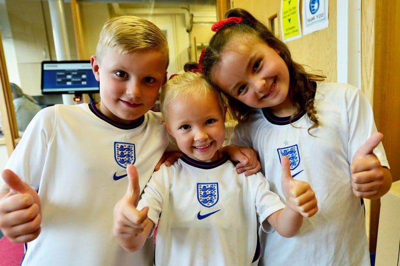 Thumbs up for England from Rossmere Primary School pupils Charlie Brackstone, Peyton Butler and Gracie Hodgson. Picture by FRANK REID