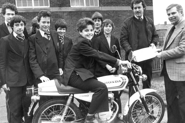 Stephen Pattinson was pictured on the motorcycle which was presented to Harton Comprehenive School, by Jos Conway's shop as part of the school's traffic programme. Peter Conway and headmaster John O'Neill are also in this 1980 photo.