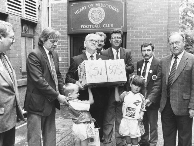 Hands Off Hibs campaigners arrive at Tynecastle to deliver their petition to Wallace Mercer.