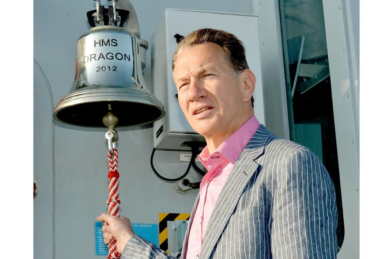 2012. Former Defence Secretary Michael Portillo onboard HMS Dragon. 
Mr Portillo was onboard filming for the BBC2 programme Great British Railway Journeys.  He will be serving the ships company breakfast and the 8 bells ceremony.