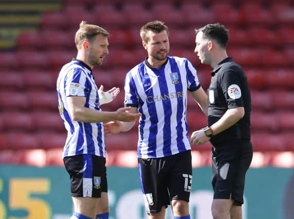 Tom Lees and Julian Borner of Sheffield Wednesday argue with referee Chris Kavanagh after Watford's winning goal. (David Klein/Sportimage)
