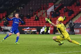 Jamie Vardy fires past Aaron Ramsdale to seal a win for Leicester City in the 90th minute against Sheffield United. (Photo by LAURENCE GRIFFITHS/POOL/AFP via Getty Images)