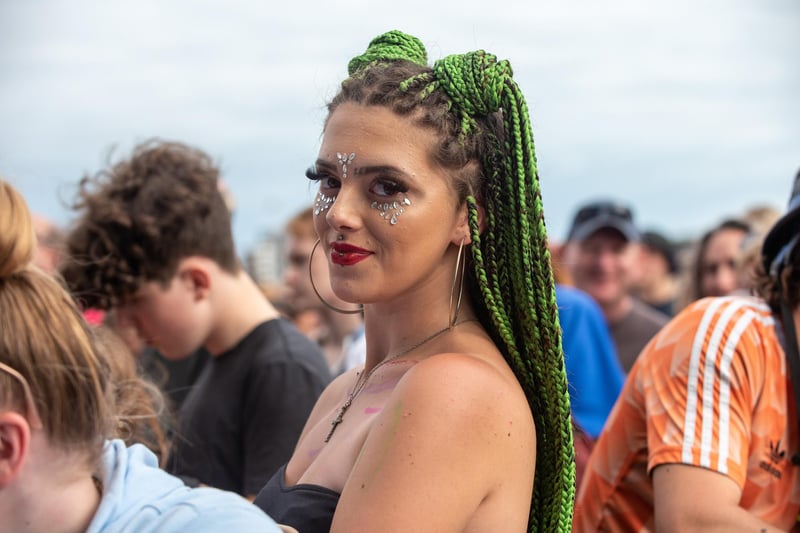 A girl in the crowd with green braided extensions. Picture: Vernon Nash (280821-135)