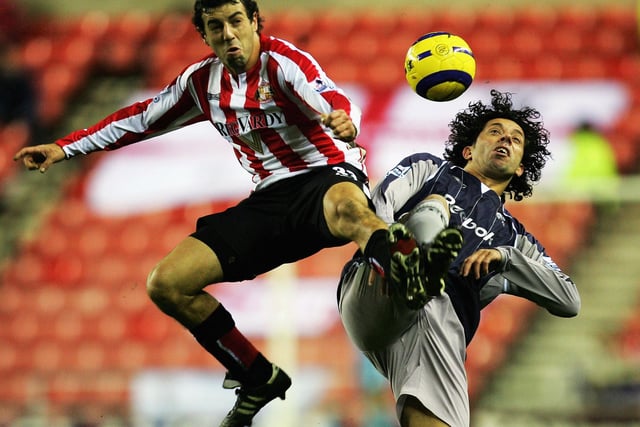 Ivan Campo of Bolton battles with Julio Arca of Sunderland during the Premier League match on December 26, 2005 at the Stadium of Light.