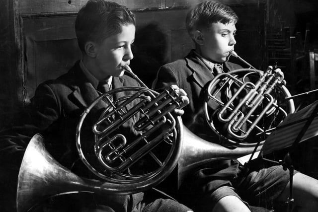 Firth Park Grammar school boys Alec Carrott and Stewart Dalton, aged 11,  learn to play the French horn