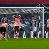 Sheffield United players' despair as another chance is missed during the Blades' 1-0 defeat at West Bromwich Albion on Saturday night. Photo: JASON CAIRNDUFF/POOL/AFP via Getty Images.