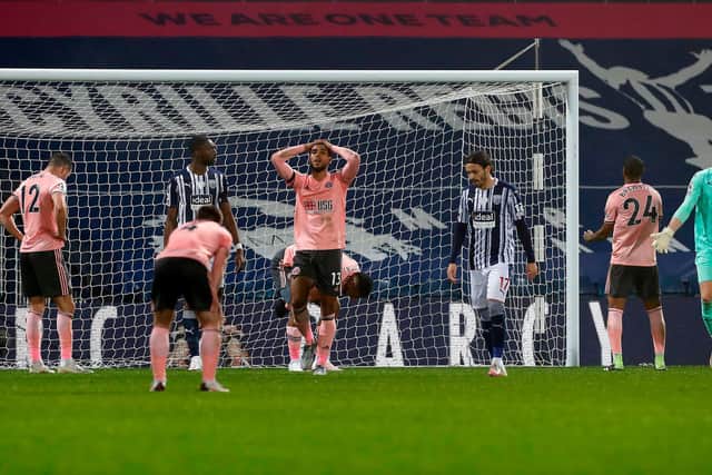 Sheffield United players' despair as another chance is missed during the Blades' 1-0 defeat at West Bromwich Albion on Saturday night. Photo: JASON CAIRNDUFF/POOL/AFP via Getty Images.