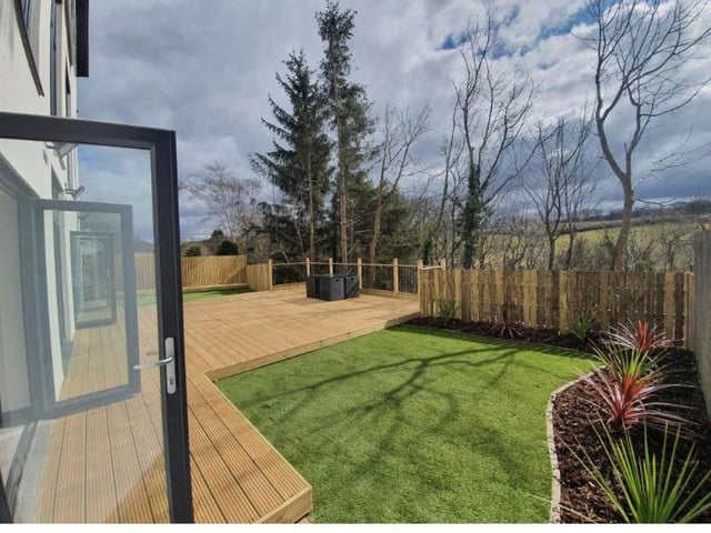 The view from the garden is also impressive, looking out to an expanse of green.