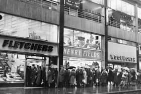 A huge queue for bread outside G.H.Fletcher and Son, bakers, on Exchange Street, in Sheffield city centre, during the bakery strike on November 25, 1965