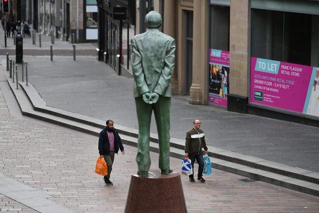 Donald Dewar watches over the near-empty Buchanan Street, Glasgow. Picture: John Devlin