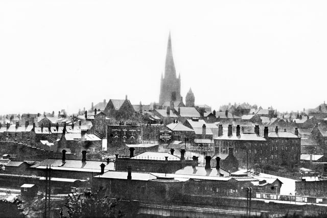 An early postcard shows Chesterfield railway station and the town's famous Crooked Spire church beyond.