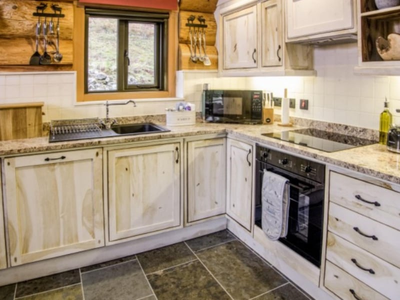 The stylish kitchen is equipped with everything you need.