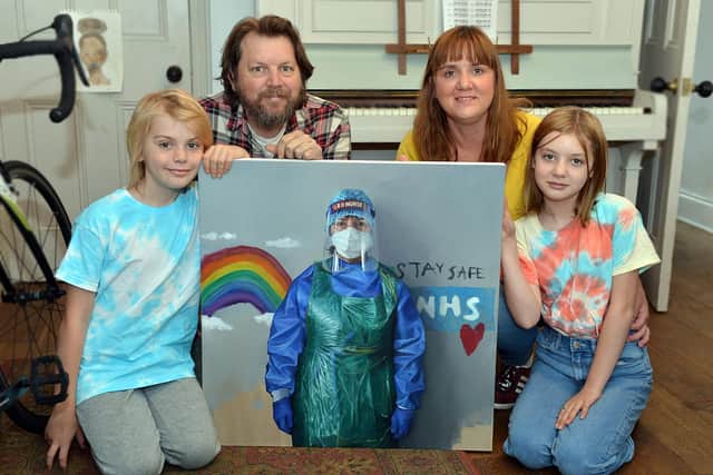 Sheffield artist Andrew Hunt painted his wife Kate an ENP in Sheffield's A&E department to create a work of art that captures the moment. Andrew, Kate, Winnie and George with the painting.