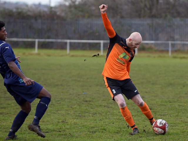 Scawthorpe's Graeme Severn plays the ball forward.