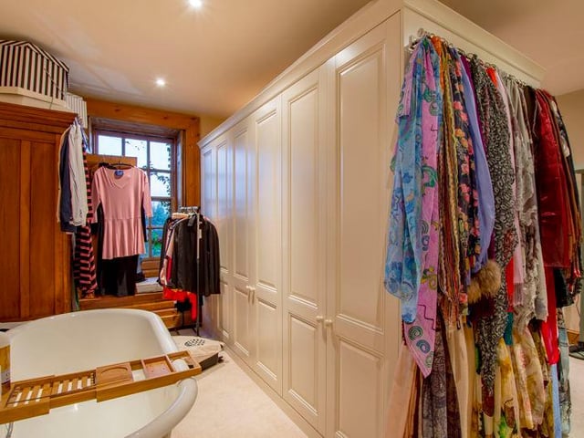 The master dressing room has fitted wardrobes.