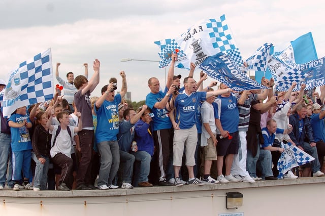 There were fans on roofs celebrating everywhere. Picture: Malcolm Wells. 082235-205