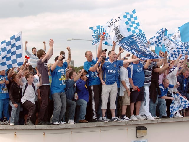 There were fans on roofs celebrating everywhere. Picture: Malcolm Wells. 082235-205