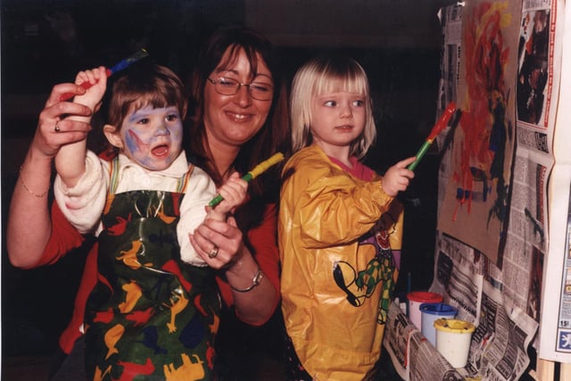 Doing a spot of 'cave painting' at  Crags Pre-School Playgroup was  Dana Marie Hunt, Maria Marsh (play leader) and Grace Unwin in 2001