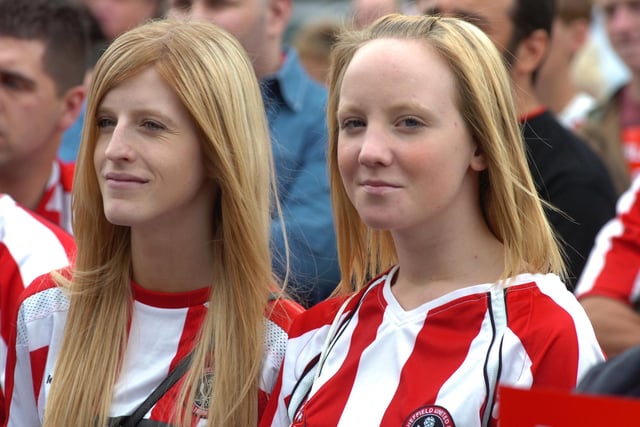 Two fans attend the demonstration after United's Premier League relegation in 2007