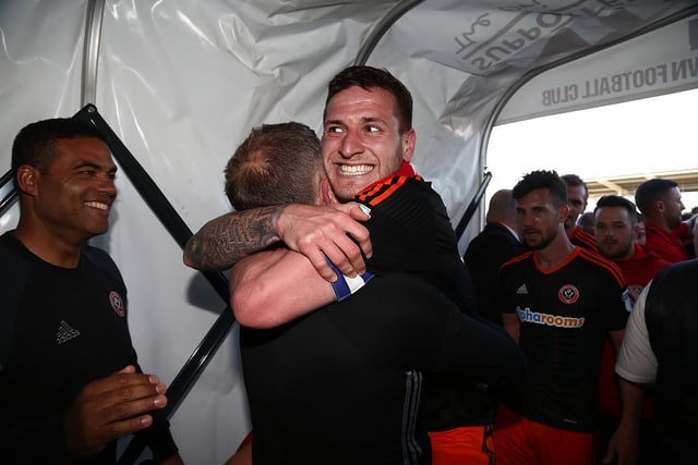 Billy Sharp celebrates with manager Chris Wilder after promotion to the Championship   (Photo by Pete Norton/Getty Images)