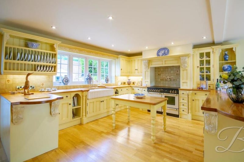 The impressive kitchen diner comes complete with traditional cabinets and units, work surface, sink and drainer with a mixer tap above, and double integral ovens. There is a window at the back, a cupboard for additional storage and central heating radiators.