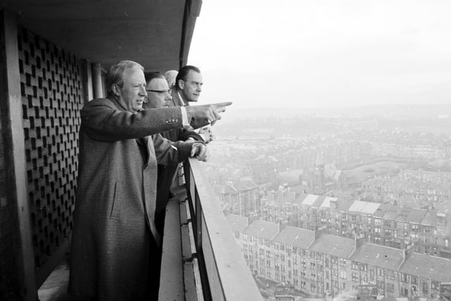 Mr Edward Heath looks from Broomhill Flats, Glasgow down to storm damaged houses in Hill Head