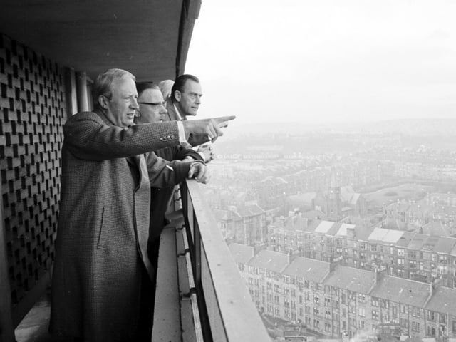 Mr Edward Heath looks from Broomhill Flats, Glasgow down to storm damaged houses in Hill Head