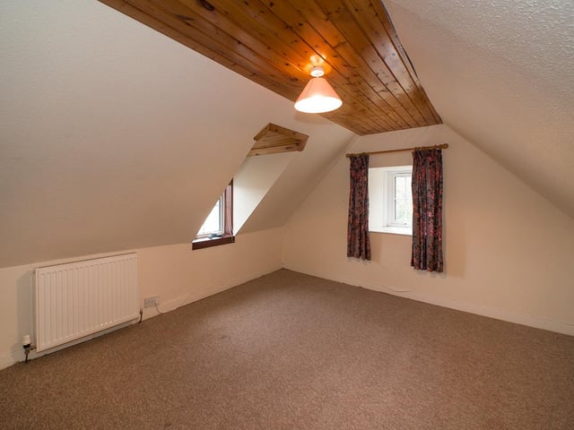 The second of three bedrooms at Dale Cottage, which again has two windows and great views