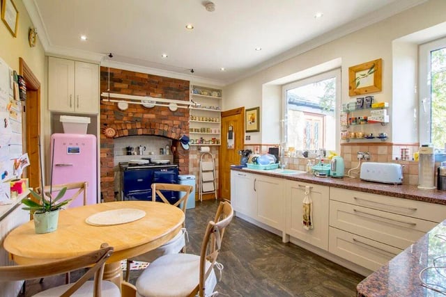 The spacious breakfast kitchen comes with an Aga range and granite work surfaces.