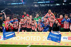 Sheffield United players celebrate being promoted to the Premier League after winning their the Sky Bet Championship match at Bramall Lane, Sheffield.  David Davies/PA Wire.