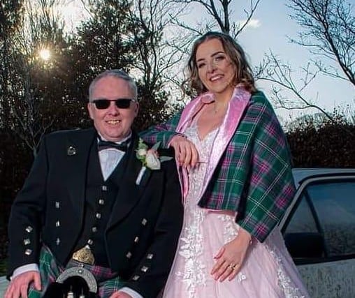 Gabrielle Sneddon and her partner Russell enjoyed a Christmas Eve wedding bedecked in tartan and a pink wedding dress.