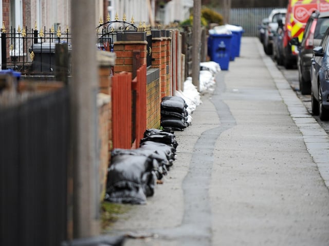 Residents of Frank Road, Bentley, make preparations for possible floods. Picture: NDFP-19-01-21-FloodAlert Bentley 1-NMSY