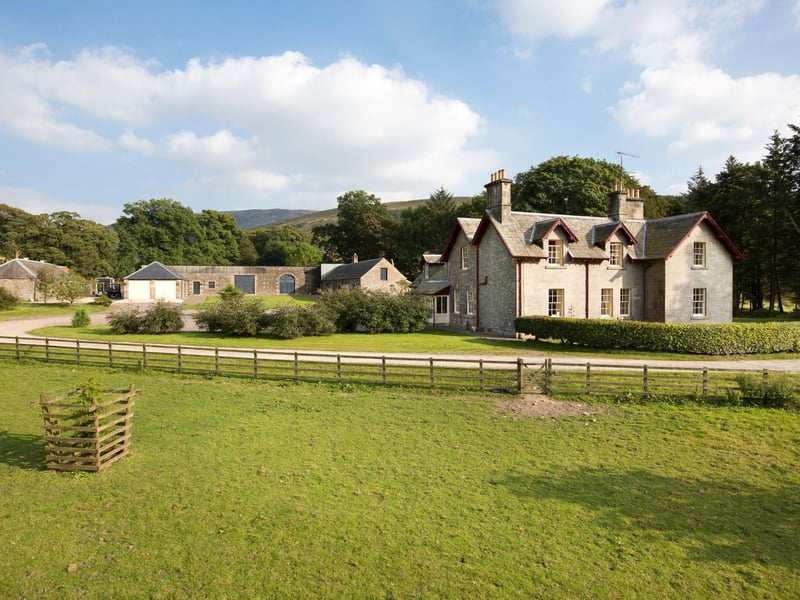 Travel down a tree-lined drive, across the Ewes Water, and past sweeping farmland to arrive at this 1860 farmhouse, designed by renowned Scottish architect William Burn.