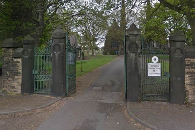 A man who was visiting his late daughter's grave in Tinsley Park Cemetery was slashed by a robber wielding a machete.